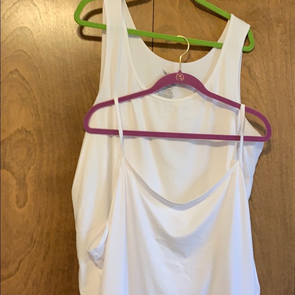 Two woman’s size sleeveless tanks